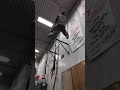 Bodybuilder climbs Rope