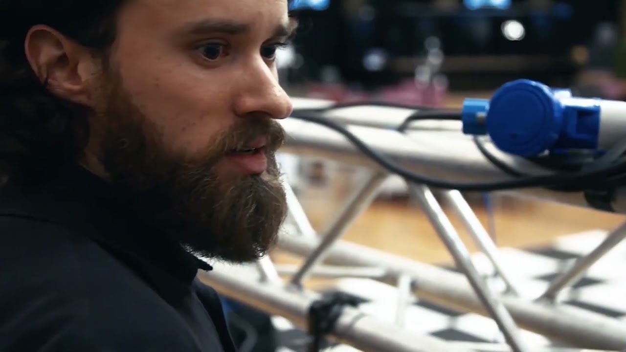 Lecturer Adam Hill works on a lighting gantry