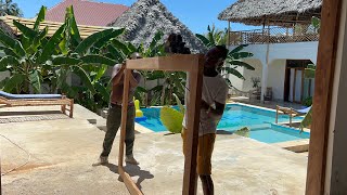 BUILDING IN ZANZIBAR WORKING ON SLIDING GLASS DOORS #building #zanzibar #island #paje #africa #beach