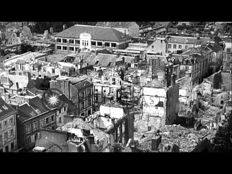 Priests walk in ruins after the bomb damage in Coutances, France during World War...HD Stock Footage