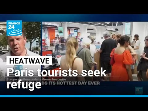Tourists on Champs-Élysées seek refuge from heat as more records tumble