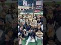 Travis Scott Takes A Photo With Everyone At HBCU Celebrity Softball Classic Billboard Shorts