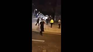 Bouncers fighting on street outside nightclub