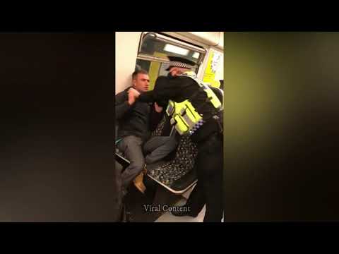 British policeman fights man refusing to wear a mask on a train