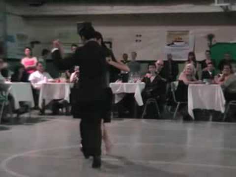  Roberto Leiva  and  Maricel Gomez  are  dancing  to  the  tango  "  Bajo el Cono Azul  "