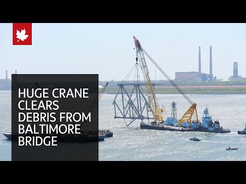 Huge floating crane swings into action to clear Baltimore bridge debris