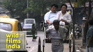 Hand-pulled rickshaws in City of Joy - Kolkata
