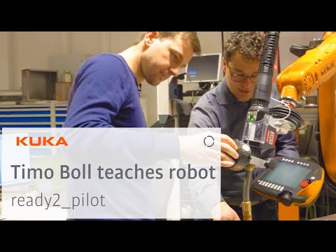 German table tennis star Timo Boll programming a KUKA Robot using KUKA ready2_pilot