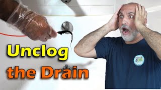 How to unclog a bathtub drain with a Snake without chemicals