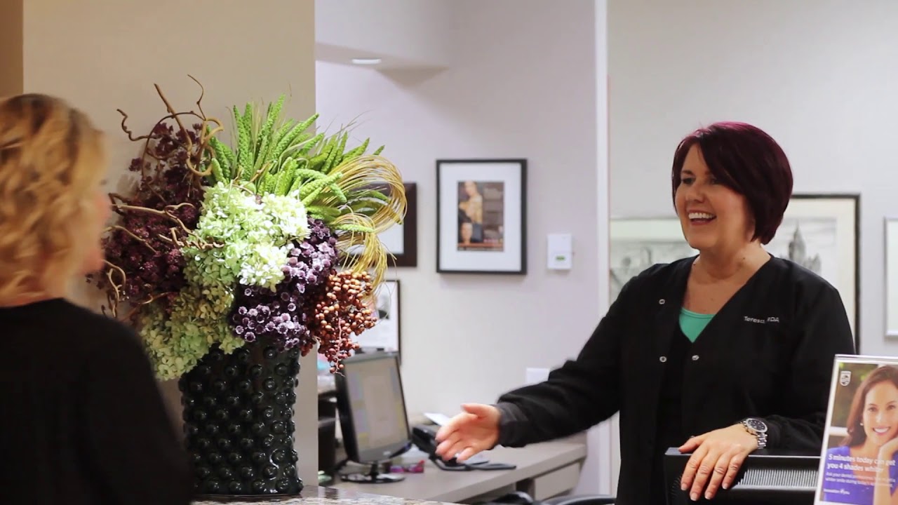 Dental team member at front desk in dental office