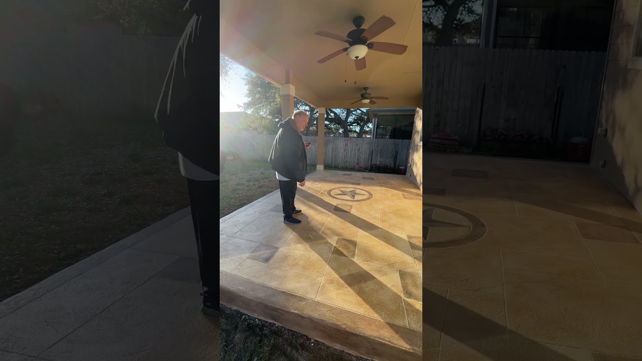 Concrete resurfacing with Texas star in middle of concrete patio transformation.  Zion Outdoors