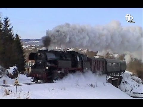 Dampflokomotiven in winterlicher Landschaft mit 65 1049 - 44 1486 - 52 8075 - 41 1231 - 41 1144