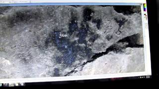 M.K.Davis discusses the giant hand print on a cave wall.