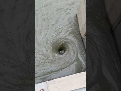 Shocking Impact: Dam Gates Opening Creates a Dangerous Vortex/black hole
