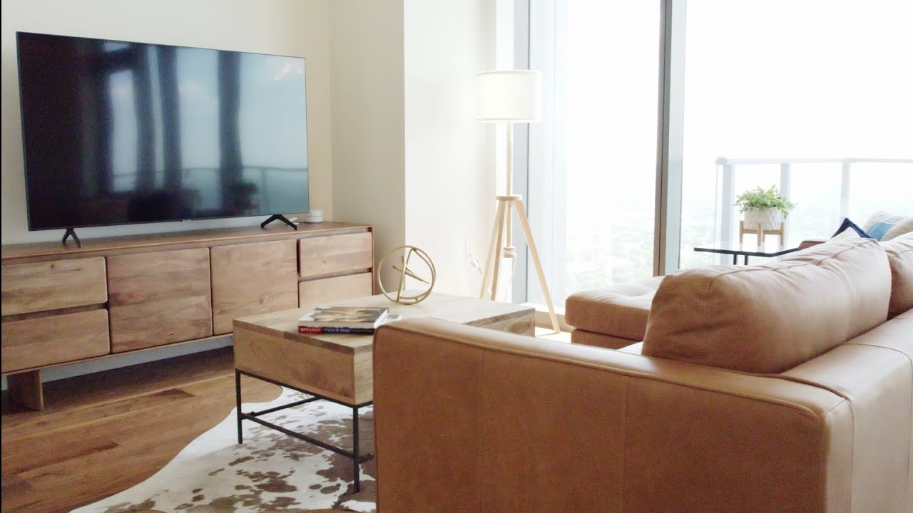 Downtown Austin high-rise listing film: living room with floor-to-ceiling windows