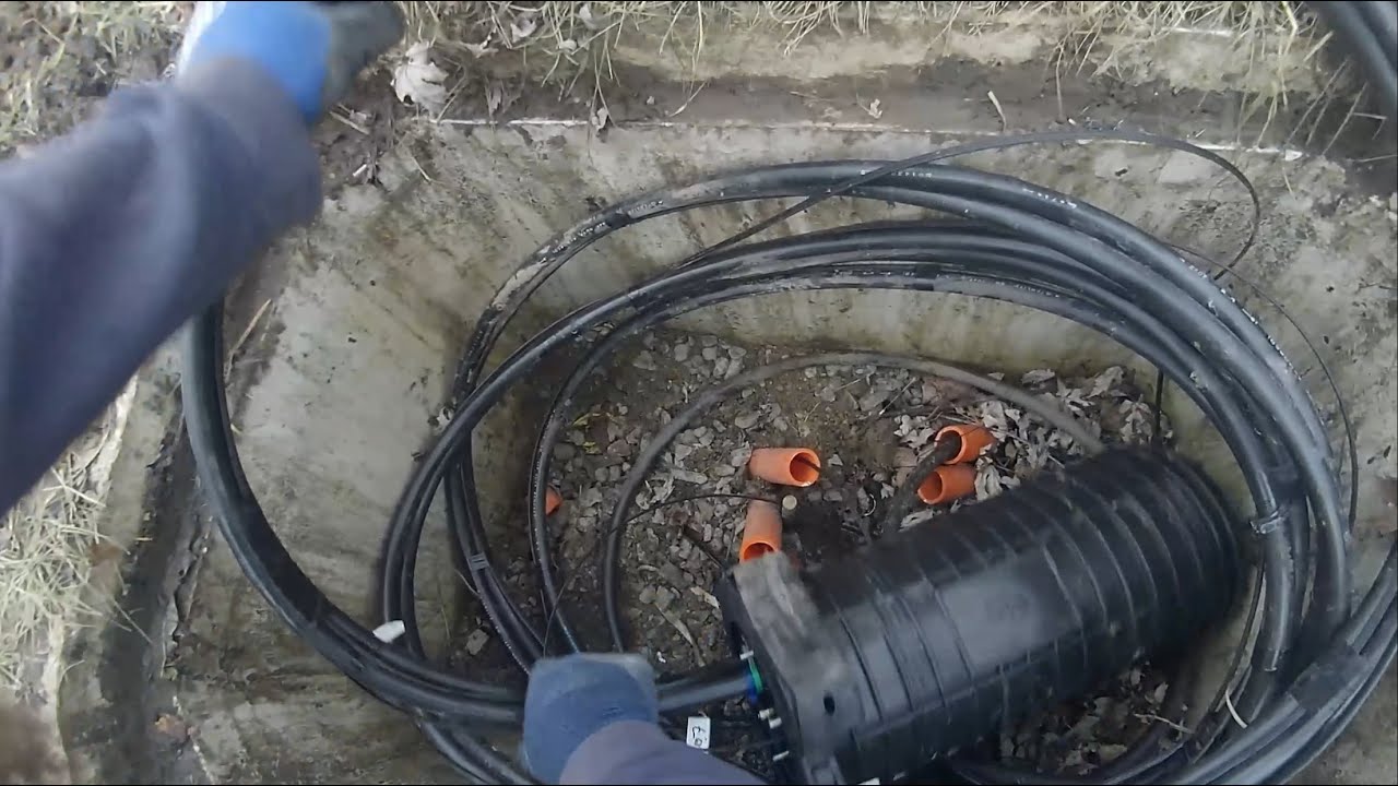 Underground fiber optic internet installation with stone driveway dig and bury