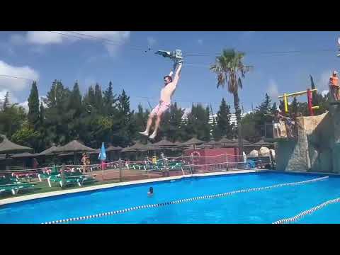 Ziplining Person Collides With Obstacle And Falls Into Pool - 1687953