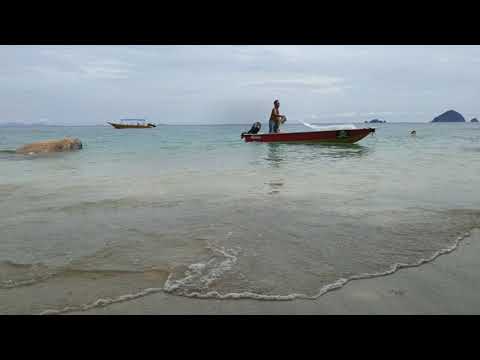 Perhentian Chomel beach and the boatsman