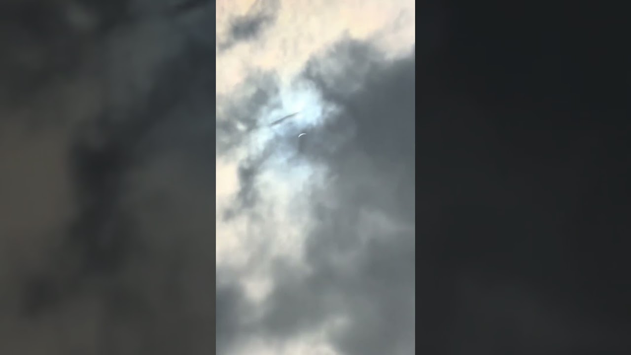 UFO spotted shooting through clouds during solar eclipse 👀 🛸