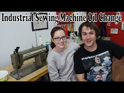 Industrial sewing machine changing the oil
