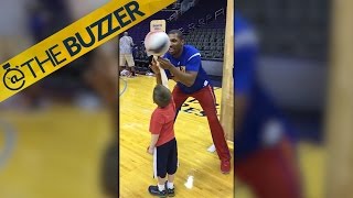 Globetrotter and young fan celebrate after completing a trick together by @The Buzzer