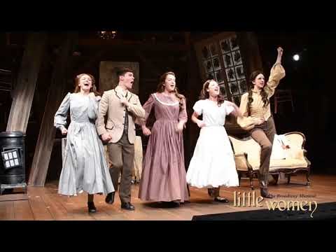 Rehearsal montage: company blocking a scene as the overture motif swells