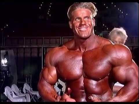 Young bodybuilder Jay Cutler getting oiled-up backstage