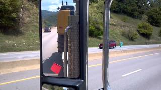 preview picture of video 'Lowboy hauling 336E up Wheeling hill'