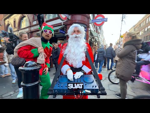 Crazy DJ Santa in London giving out presents