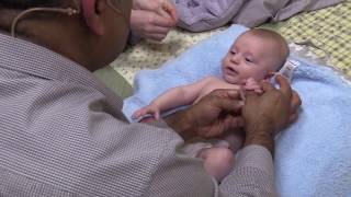 Dr. T's Baby Massage Method, massaging the arm