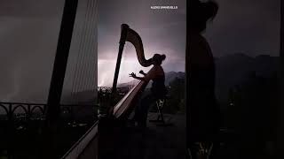 Harpist performs as lightning flashes across northern Utah sky