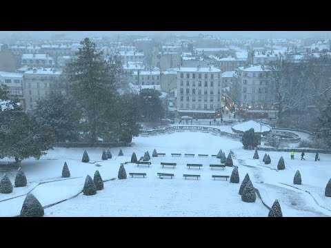 Paris rooftops turn white as fresh snowfall sweeps across northern and western France | AFP