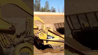 CAT 657G scraper deep in the cut