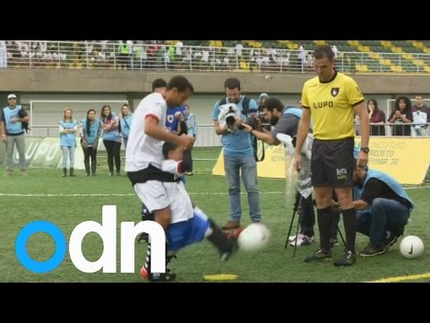 Neymar helps disabled children to play soccer