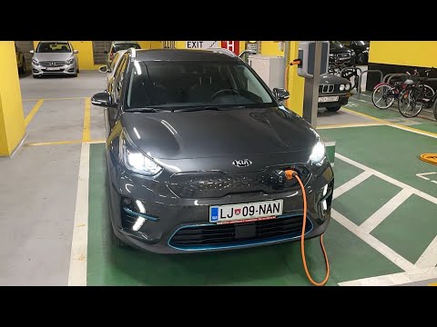 Part of a video titled How to remove the charging cable from KIA e-Niro 2021 - YouTube