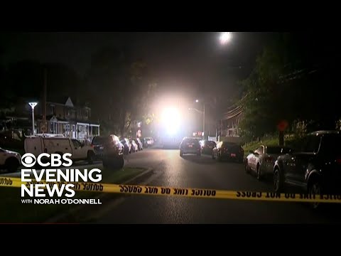 Two suspects at large after Baltimore mass shooting
