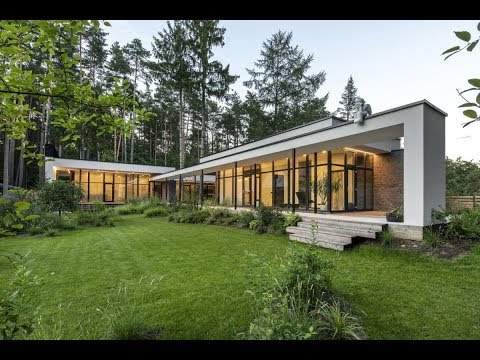 A Serene House Lets Pine Trees Grow Through Its Decks and Roofs