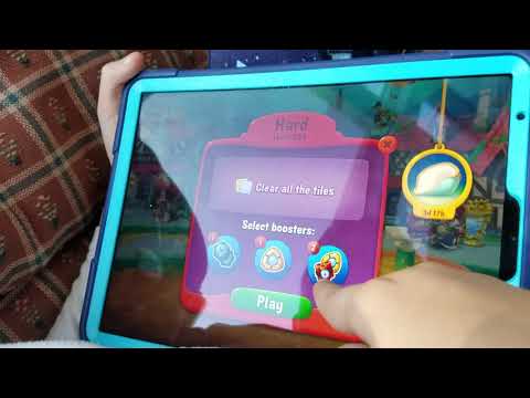 Daniel playing Fishdom on his iPad