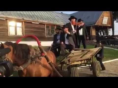 Chabad Rabbi Plays Violin on Back of Horse-drawn Buggy at Russian Convention