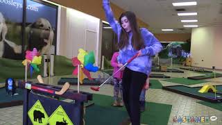 Emma tries minigolf