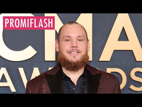 Luke Combs und seine schwangere Frau posieren auf Red Carpet