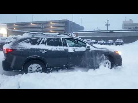2020 Outback Touring in deep snow on stock all season tires.