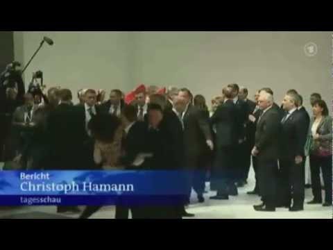 Nude Femen activists rush at Putin and Merkel in Hannover