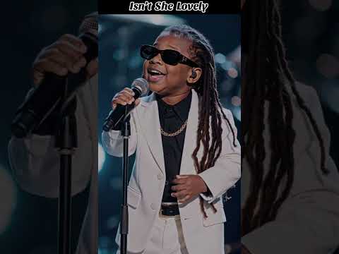 a young performer, likely a child, singing Isn't She Lovely by Stevie Wonder, a song from his 1976 a