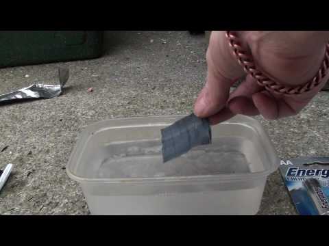 A  dismantled Lithium Energizer AA battery with fizzing Lithium.©