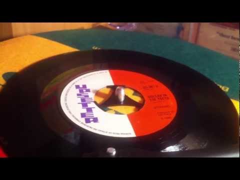 Upsetters - Dollar in the Teeth.
