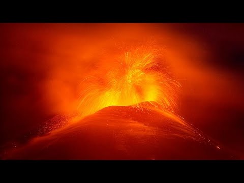 Mount Etna erupts, spewing lava and lighting up night skies once again