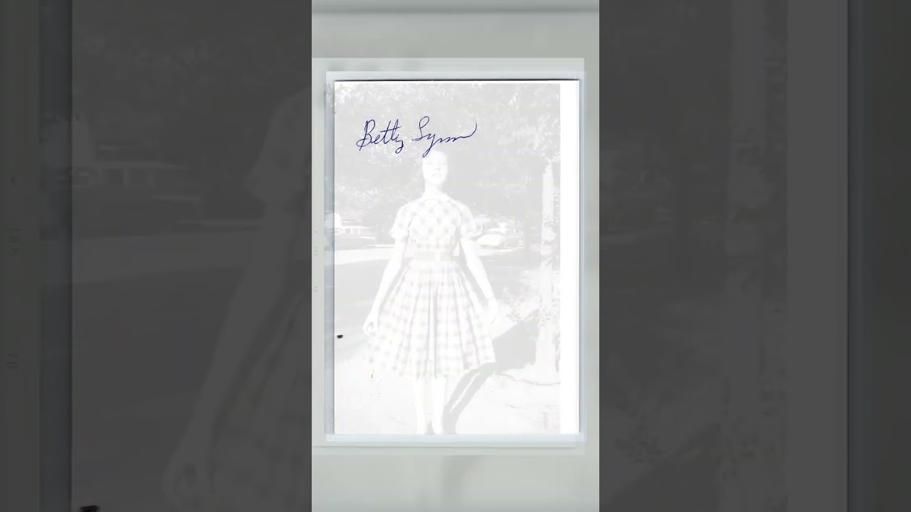 Girl in Plaid Dress, Black and White Photograph, 3.5 × 5 inches, 1970s Video