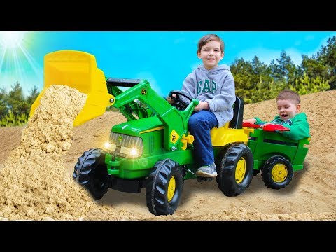 Children assembled and fixed the tractor John Deere | Toys 2 Boys