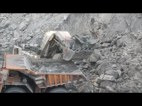Loading Big Chunks of Rocks Liebherr R9350 Excavator Loading the Dump Truck With Big Copper Rocks